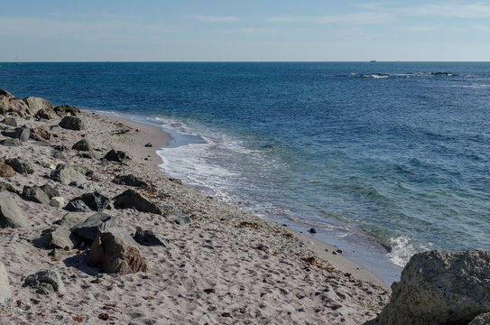 Fototapeta Seascape of wave movements in the Black Sea sandy coast and rock near ancient city Nessebar or Mesembria, Bulgaria, Europe