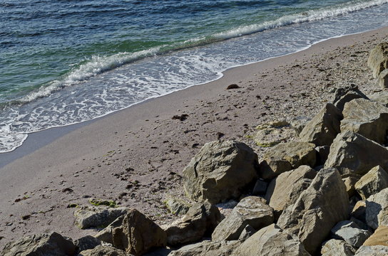 Fototapeta Seascape of wave movements in the Black Sea sandy coast and rock near ancient city Nessebar or Mesembria, Bulgaria, Europe