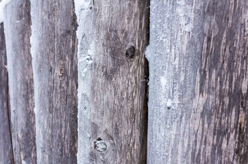 Natural background: wood logs covered with hoarfrost