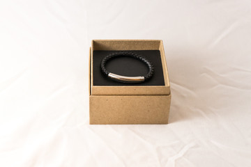 Braided leather men's bracelet with silver insert in the packing box