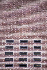 Mailbox slots on a red brick wall an old fashioned building
