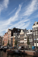 Typical view of canal embankment in historic center of city, Amsterdam, Netherlands.