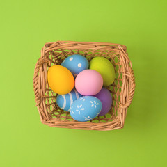 Easter holiday concept with easter eggs in basket decorations.