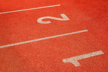 Fototapeta premium Red running track Synthetic rubber on the athletic stadium.
