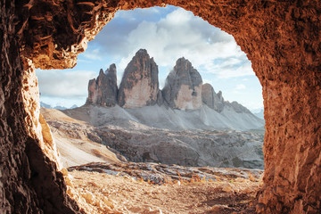 Cloudy sky. Tre Cime mountains of three peaks. Gorgeous photo in the sunny day. Italian landscapes