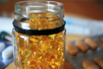 Yellow capsules in a jar