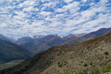 mountain view during the daytime. mountains, valley, clouds, reflection from the clouds on the mountains, forest, summer