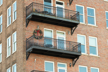 Christmas Bow on Apartment Balcony