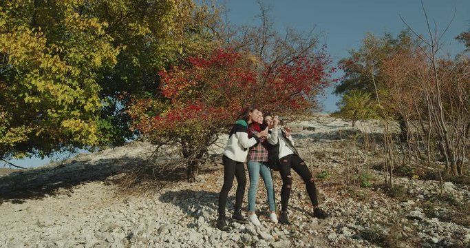 Perfect time for three best friends ladies taking pictures at nature , on the exhibition. 4k