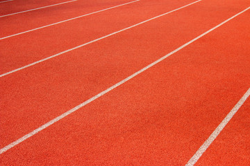 Fototapeta premium Red running track Synthetic rubber on the athletic stadium.