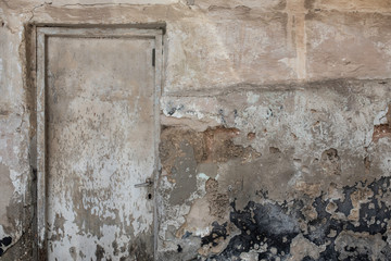 Old Closed Door and a Peeling Wall