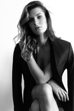 A girl without underwear in black jacket