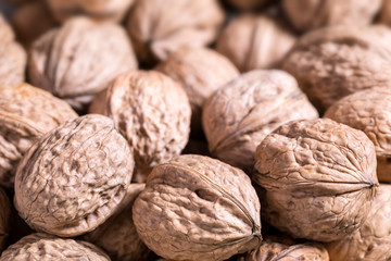 Walnuts in a shell blurred background, copy space, close-up, top view