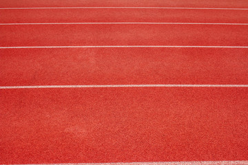 Red running track Synthetic rubber on the athletic stadium.