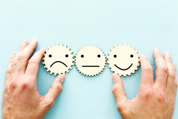 concept photo of chosen person among others. a smiling face stands out from the crowd