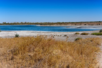 salty lake in sandy desert.  Uzbekistan