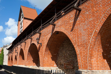 Fototapeta premium red wall of medieval fortress, Riga Old City