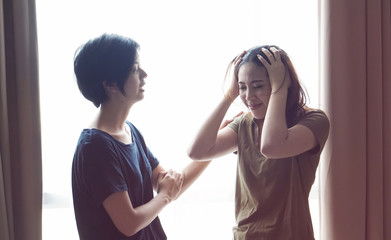 Asian women friends stress on difficult situation, fighting problems