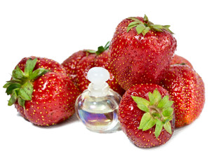 strawberry, ripe berries and cosmetic bottles