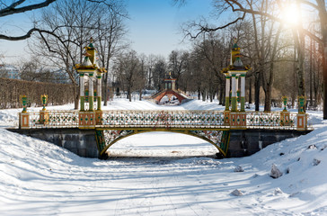 Small Chinese bridge winter day in a snowy Alexander park in Pushkin (Tsarskoye Selo), near Saint...
