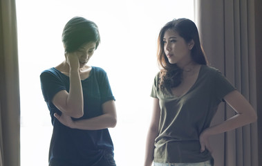 Asian women friends stress on difficult situation, fighting problems