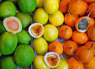 Basket of colorful ripe passion fruits at a food market