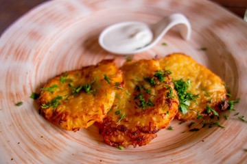 Potato pancakes draniki with sour cream 