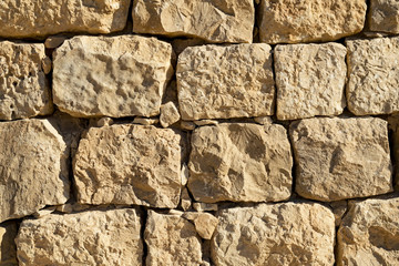 detail of an ancient stone wall on the south side of shivta national park in the negev desert in israel
