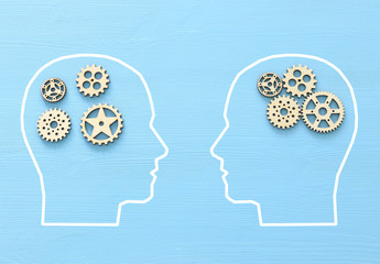 Brain disorder against order made from wooden cogwheels into human head. Concept of alzheimer's...