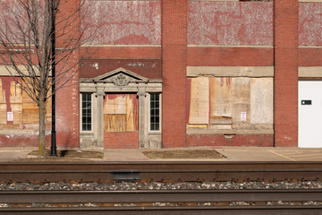 Empty boarded up old building