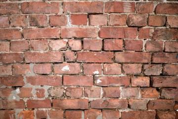 Dilapidated old brick wall as the basis of the background.