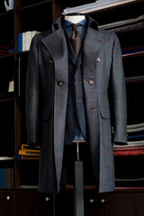 Mannequin with bespoke coat in atelier