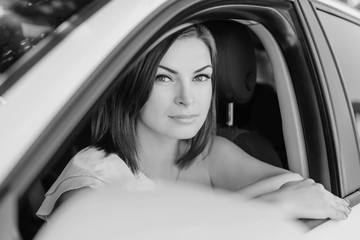 portrait of young woman in car