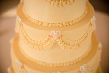 closeup of white wedding cake with flowers