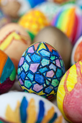Detail of painted Easter eggs with different forms, cartoons and bright colors