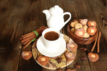 Fototapeta na wymiar cup of coffee and cookies on wooden rustic table