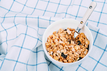 Healthy breakfast concept. Granola with honey, raspberries and sour cream