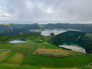 Drone view of amazing lagoon. Lake formed by the crater of an old volcano in San Miguel island, Azores, Portugal. Bird eye view, aerial panoramic view.