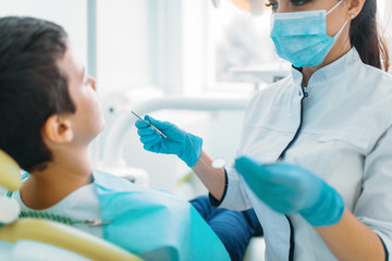 Smiling little boy in a dental chair