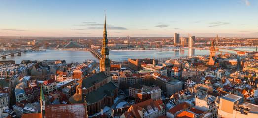 Aerial winter sunset over Riga old town and river Daugava in Latvia.