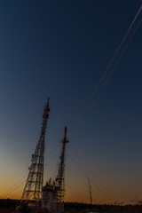 Fototapeta premium Traces of airplanes in the sky on a summer night.
