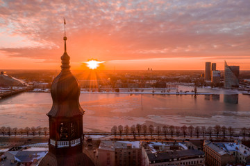 Golden cock on the top of the Dome Cathedral during sunset. Beautiful Riga wallpaper