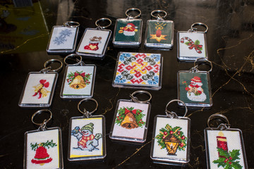 Small key chains with embroidered Christmas motives.