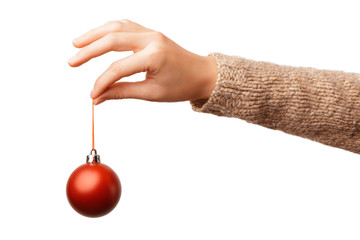 Christmas concept with hand and red ball - christmas tree toy. Red round christmas ball in female hand isolated on white background. Alpha.