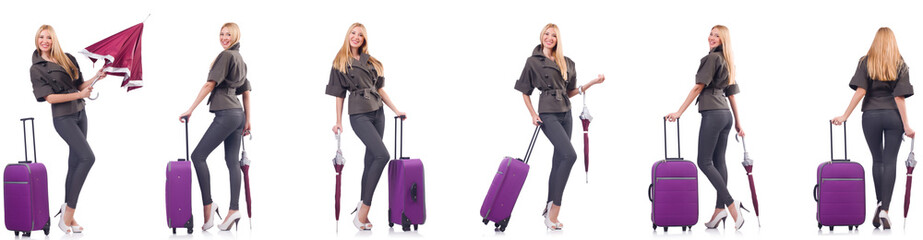 Young beautiful woman with suitcase and umbrella isolated on whi