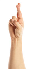 Man hand showing crossed fingers lie symbol isolated on white. Alpha