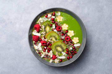 Healthy Breakfast Detox Green Smoothie with Banana and Spinach in a Bowl, Top View