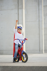 A funny, little superhero. Concept boy imagination. Happy childhood.