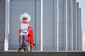 A funny, little superhero. Concept boy imagination. Happy childhood.