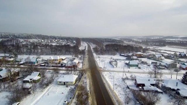Rural Crossroads Aerial View. Villages near river. Winter and snowfall